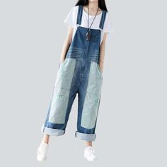 Introducing our 2023 Autumn Collection contrast color women's denim overalls ââ‚?a street style wardrobe staple that promises to make you the talk of the town!Why You'll Fall In LoveThis jumpsuit is the perfect amalgamation of modern fashion sensibilities and Y2K nostalgia. Crafted with love and care. it features a loose. baggy silhouette. intricate painted prints. and a sanded finish for a unique texture. Its vibrant color and delicate suspenders and buttons closure make for an eye-catching ens Spring Jeans With Contrast Stitching, Blue Baggy Straight Leg Overalls, Baggy Blue Straight Leg Overalls, Trendy Denim Jeans With Contrast Color, Trendy Denim Jeans With Contrast Color Details, Spring Denim Jeans With Contrast Color, Denim Jeans With Contrast Color For Spring, Spring Jeans With Contrast Color, Trendy Spring Jeans With Contrast Color