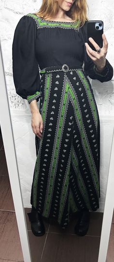 It's a Vintage 70s boho beautiful maxi evening dress. Puff sleeve. With belt. Fit flare design. Puff sleeves. Brand: CHERMAN OF London. Size: XS. Material:  Great vintage condition. Model's height: 5'8 / 178 cm / Size S. MEASUREMENTS: Shoulders: 14 inch / 35 cm. Sleeve: 21 inch / 54 cm. Bust doubled: 30 inch / 78 cm. Waist doubled: 24 inch / 62 cm. Length: 58 inch / 147 cm. Worldwide shipping. Shipping takes to: USA 7-14 days.  EU 4-7 days. Others countries 7-14 days. Bohemian Wide Leg Maxi Dress For Spring, Bohemian Full-length Spring Dress, Bohemian Full Length Spring Dress, Vintage Fashion Long Sleeve Black Dress, Black Long Sleeve Dress For Vintage Fashion, Bohemian Maxi Dress With Vintage Print, Green Long Sleeve Retro Maxi Dress, Retro Green Long Sleeve Maxi Dress, Black Vintage Long Sleeve Maxi Dress