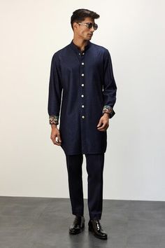 Navy blue jacket kurta featuring dori embroidery all over. Paired with a solid straight pant. - Aza Fashions Indigo Traditional Wear With Chikankari Embroidery And Long Sleeves, Fitted Long Sleeve Kurta With Embroidered Cuffs, Eid Fitted Kurta With Embroidered Cuffs, Festive Cotton Kurta With Embroidered Cuffs, Traditional Kurta For Workwear, Designer Fitted Kurta With Embroidered Cuffs, Fitted Sets With Embroidered Cuffs For Festive Occasions, Traditional Straight Kurta Set With Embroidered Cuffs, Traditional Set With Straight Kurta And Embroidered Cuffs