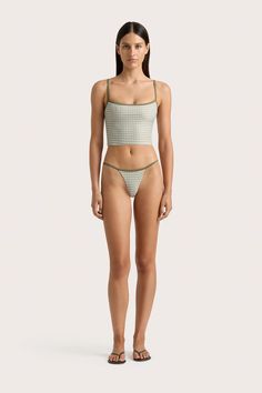 A fitted swim top, cropped just above the waist. Printed in Oliander Floral with adjustable Khaki straps, pair with the Manon Bikini Bottom or style as ready-to-wear with a relaxed pair of trousers. Casual Cropped Bottoms With Built-in Bra, Spring Cropped Beachwear Bottoms, Summer Cropped Beachwear Bottoms, Fitted Seamless Cropped Bottoms, Summer Cropped Bottoms For Poolside, Beach Seamless Crop Top With Tank Straps, Fitted Cropped Bottoms For Vacation, Seamless Crop Top With Tank Straps For The Beach, Green Fitted Cropped Bottoms