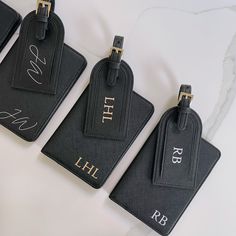 Travel in style with this bold and beautiful monogrammed passport holder & matching luggage tag. Create your own personal touch by adding initials in the colour of your choice. Available in classic black, each passport cover has a lovely soft lining three credit card slots. The luggage tag has an adjustable strap with gold detailing. Want your travel set wrapped? Add gift wrapping and it will arrive in a branded bag so you can send it directly to the recipient. Interested in seeing our other fab Luxury Rectangular Luggage Tag With Sleeve, Modern Rectangular Card Holder For Travel, Luxury Rectangular Luggage Tag For Gift, Black Luggage Tag With Luggage Sleeve For Travel, Modern Black Luggage Tag For Everyday Use, Black Rectangular Luggage Tag With Sleeve, Modern Black Luggage Tag, Black Rectangular Luggage Tag For Travel, Luxury Black Card Holder For Travel