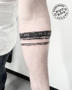 a man's arm with a barcode tattoo on it and his name tattooed