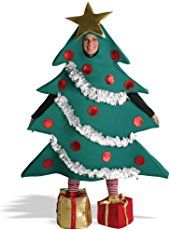 a cardboard christmas tree with presents under it and a smiling child in the middle,