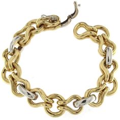 Unusual desing in a style coupled chain bracelet with great visual effect in Yellow gold whit white links. Total weight of gold 18 kt gr 57.60 Stamp 750 Formal Yellow Gold Bracelets With Hook And Links, Yellow Gold Chain Link Bracelet With Hook And Links, White Gold Bracelets With Oval Links, Elegant Gold Chain Bracelet With Hooks And Links, Elegant Formal Chain Bracelet With Hook And Links, Modern Formal Bracelets With Hook And Links, Modern White Gold Bracelet With Solid Link, Luxury Yellow Gold Chain Bracelet With Hooks And Links, Yellow Gold Link Chain Bracelet With Hook