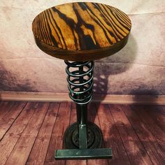 a wooden stool sitting on top of a hard wood floor