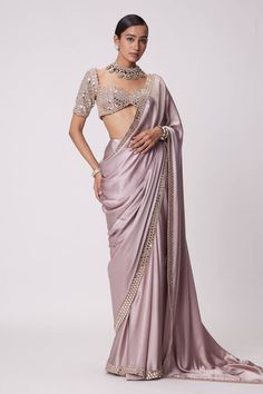 Ash pink saree crafted in satin with prism sheesha embroidery on the border. Paired with a half sleeves sweetheart neck blouse with mirror-vine embroidery. - Aza Fashions Festive Satin Pre-draped Saree, Evening Satin Saree With Unstitched Blouse, Evening Saree With Unstitched Blouse In Satin, Satin Pre-draped Saree With Pallu For Wedding, Bollywood Style Satin Saree For Evening, Wedding Satin Pre-draped Saree With Pallu, Satin Saree For Party, Elegant Satin Saree With Resham Embroidery, Fitted Satin Saree For Designer Wear