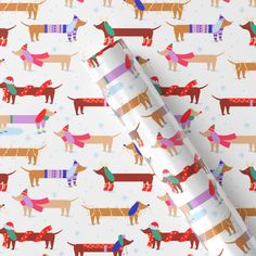 a wrapping paper with dogs on it and snowflakes in the backgroud