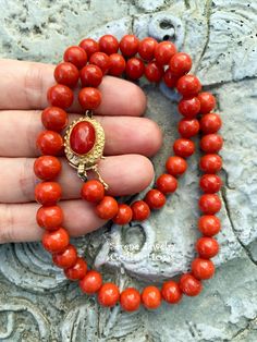 Simple and elegant Sardinia coral bead necklace with an 18k yellow gold clasp! Total Weight: 45.86 grams Necklace Length: 17 inch 18k gold clasp: 18.8mm x 13.7mm Precious Metal: 18k gold Precious stones: -Coral Round Beads: 8.1mm to 9mm diameter -Coral Faceted Oval: 12..3mm x 8.5mm Formal Necklace With Gold Clasp, Formal Single Strand Red Coral Necklace, Formal Round Necklaces With Gold Clasp, Formal Coral Single Strand Beaded Necklace, Elegant Hand-strung Coral Necklaces, Elegant Hand-strung Coral Necklace, Elegant Coral Hand-strung Necklaces, Elegant Red Coral Round Bead Necklaces, Elegant Red Coral Round Bead Necklace