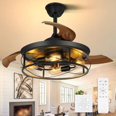 a living room with a ceiling fan and a tv in it's centerpiece