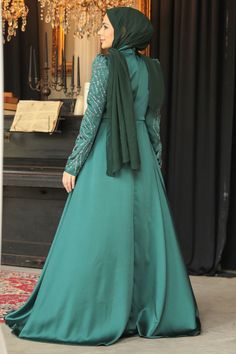 Introducing our stunning Sparkling Evening Dress Hijab, designed exclusively for the modern, modest woman. Available in elegant green and blue shades, this evening dress features exquisite embroidery that adds a touch of glamour to any special occasion. Perfect for engagements, proms, or elegant soirées, it combines style and modesty seamlessly. The maxi design provides graceful coverage while allowing you to feel confident and beautiful. Crafted from high-quality Islamic cloth, this dress ensur Green Embroidered Gown For Evening, Elegant Green Sequined Maxi Dress, Formal Green Embroidered Dress, Green Embroidered Evening Gown, Eid Green Floor-length Maxi Dress, Elegant Embroidered Gown For Eid, Elegant Embroidered Eid Gown, Elegant Green Sequin Dress, Green Maxi Dress For Eid