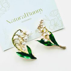 This stunning Lily Of The Valley Dangling Flower Brooch features an exquisitely detailed depiction of a lily of the valley flower. It's a lovely accessory to elevate any outfit with elegance. Representing purity, humility, and happiness, this brooch makes a heartfelt present for a special person or a cherished addition to your jewelry collection. Its timeless design and versatile style ensure it will be a beloved piece for years to come. The option for choosing a gift box and wrapping specifical Lily Of The Valley Flowers, Valley Flowers, Lily Of The Valley, Special Person, Flower Brooch, Versatile Style, The Valley, Mother's Day Gift, Timeless Design