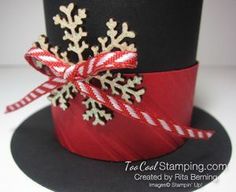 a top hat decorated with snowflakes and candy canes is shown in this image