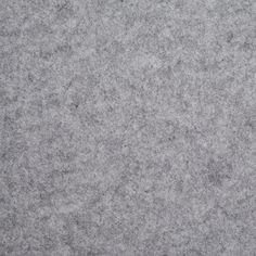 a close up view of the surface of a gray carpet