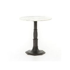 a white marble top table with black metal base