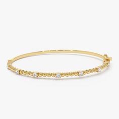 Enhance your wrist's beauty with our Diamond Bracelet Bangle, a striking piece featuring 14K Gold Beaded detail and a minimalist design. This Gold Layering Bracelet adds a touch of elegance to your ensemble, perfect for stacking or wearing alone. Explore the allure of our Minimalist Beaded Diamond Bracelet, an exquisite and thoughtful gift idea that radiates timeless charm. ▶ Item Details * Made to Order.  * Gold Kt: 14K Solid Gold (also available in 18K upon request) * Custom Gold Color: Rose Gold, Yellow Gold, White Gold * Round Diamonds: 7 Pcs 2.3 MM * Total Diamond Weight: 0.35CTW * Ready to Ship in 3-10 Business Days ▶ See more of our Gold Bangle - http://etsy.me/2l9VKBr ▶ See our storefront here - http://etsy.me/2lUcVnH  ▶ All store sections here * Diamond Rings - http://etsy.me/2lwK 14k Yellow Gold Rondelle Bracelets, Classic Yellow Gold Rondelle Beaded Bracelets, Classic Yellow Gold Rondelle Bracelets, White Gold Beaded Jubilee Bracelet, Modern Yellow Gold Bracelets With Round Beads, Modern Hand Set Yellow Gold Bracelets, Modern Hand Set Yellow Gold Bracelet, Modern Hand-set Yellow Gold Bracelet, Yellow Gold Stackable Rondelle Bracelets