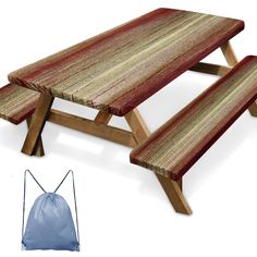 a picnic table with two benches next to it and a drawstring bag on the floor