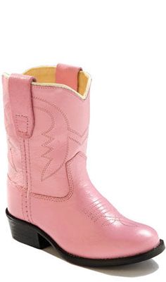 a pink cowboy boot with black soles on the bottom and heel, in front of a white background