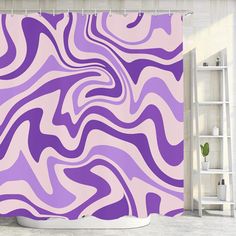 a purple and white shower curtain in a bathroom