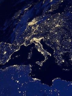 the earth is lit up at night from space