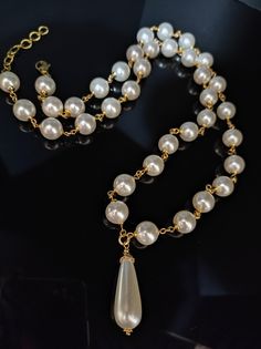 Beautiful long 1950s style necklace, made with large white Majorca pearls /12 mm/. The necklace is with a drop pendant. The necklace is very elegant, perfect for low-cut evening dresses but also for a single-colored winter sweater. The necklace is 81cm long and has an adjustable clasp with a 6cm extension. Perfect for those who love elegant style. All jewels are delivered in a decorated box, ready to be given as a gift to your loved one. How to take care of your jewellery: put on your beauty products (cosmetics, perfumes, ...) before wearing your precious jewel. Clean your jewelry with a soft cloth after wearing. Don't use water. Make sure you store your jewelry separately to avoid scratching it. Store away from heat sources, in a dry place in the special box. SHIPPING CONDITIONS I ship to Classic White Pear Drop Necklace, Formal Pearl White Drop Pearl Necklace, Formal Drop Pearl Necklace, Long Drop Pearl Necklace, Formal Drop Pearl Necklace With Pearl Chain, Formal Drop Pearl Chain Necklace, White Pearl Chain Drop Necklace For Party, Formal Drop Pearl White Pearl Necklace, Classic Drop Pearl Necklace