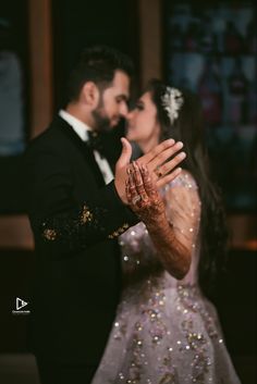 a bride and groom posing for the camera