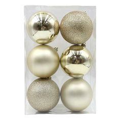 gold and silver ornaments in a clear box