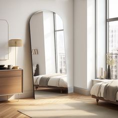 a bedroom scene with focus on the bed and mirror