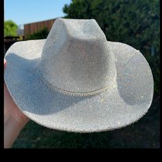 This White & Crystal Combination Cowboy Hat Is Perfect For Any Concert, Nashville Trip, Western Birthday Party, Bachelorette Party, Music Festival, Tiktok Show. This Hat Will Match Every Outfit You Have. Size: One Size Fits Most Adults Up To 22 Inches In Size. The Circumference (Inside) Of The Cowgirl Hat Is Approx. 22 Inches. To Ensure The Proper Fit Measure Your Head With A Soft Tape. This Hat Fits Traditional Hat Sizes Of 6 7/8, 7, And 7 1/8. Material: Hard Felt & Crystal Rhinestones Hat Band Rhinestone Short Brim Hat For Kentucky Derby, Short Brim Rhinestone Hat For Kentucky Derby, Kentucky Derby Rhinestone Hat With Short Brim, Rhinestone-embellished Short Brim Hat For Kentucky Derby, Silver Party Hat With Bling, Elegant Silver Hat With Bling, Elegant Silver Hats With Bling, Western Silver Hats For Parties, Western Style Silver Hats For Party