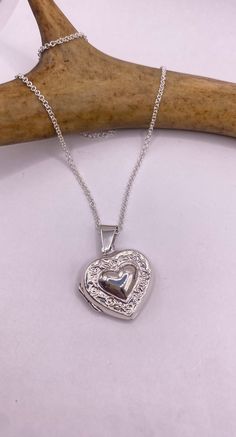 Vintage Heart Locket crafted with love in 925 sterling silver.  Measures about 1/2 inch (almost 13mm) long without its bale and features a lovely etched design   It comes with a matching 925 sterling silver chain available in 16, 18, 20, 22, or 24 inches  This locket can hold a tiny-sized photo. For long-lasting preservation, we recommend laminating your photo before inserting it.  As a veteran-owned , small business, we truly appreciate your support.  All our jewelry is shipped free within the Silver Locket, Heart Locket Necklace, Sterling Silver Chain Necklace, Photo Locket, Silver Lockets, Tiny Heart, Photo Heart, Vintage Heart, 925 Sterling Silver Chain