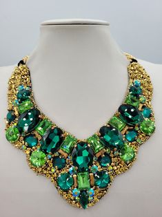 Green Crystal Necklace With Stones, Luxury Green Crystal Necklaces, Green Crystal Necklace With Jewels, Unique Green Necklaces For Celebration, Unique Rhinestone Necklaces For Gifts, Unique Rhinestone Necklace For Gifts, Green Choker Necklace For Celebration, Gift Necklace With Rhinestones, Luxury Handmade Necklace For Party