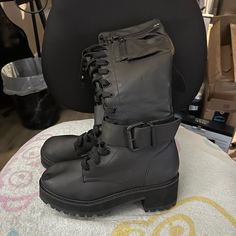 Never Worn. Size 8 Edgy Black Combat Boots For Fall, Edgy Black Fitted Combat Boots, Black Fitted Edgy Combat Boots, Trendy Black Moto Boots For Spring, Trendy Black Moto Boots, Black Moto Boots For Night Out In Fall, Trendy Fitted Black Combat Boots, Black Moto Boots For Night Out, Casual Black Combat Boots For Fall