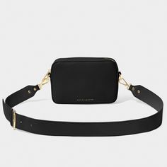 Look chic and stay organized with the Zana Mini Crossbody Bag! Featuring golden hardware, a convenient slip pocket, and a wide, detachable crossbody strap, this mini crossbody bag is the perfect accessory for any style. Taking them from desk to office to a night-out with ease. Details Color: Black Dimensions: 5" x 2" x 7.3" By Katie Loxton London Zana Mini Crossbody Bag By Katie Loxton Chic Belt Bag With Detachable Strap For On-the-go, Chic Crossbody Camera Bag For Daily Use, Chic Everyday Belt Bag With Adjustable Strap, Modern Crossbody Camera Bag With Phone Pocket, Modern Crossbody Camera Bag With Phone Holder, Elegant Crossbody Camera Bag With Adjustable Strap, Chic Everyday Crossbody Camera Bag, Luxury Crossbody With Detachable Strap, Chic Camera Bag With Removable Pouch For Everyday