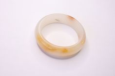 "White and Brown Jade Bangle | Marble Style Bangle | Stunning Exterior measurement: 3.104\" Interior measurement: 2.379\" Bangle Width: 18.55mm Bangle Length: 10" Adjustable Round Bangle For Formal Occasions, Modern White Bangle For Formal Occasion, Formal Adjustable Round Bangle, Modern Adjustable White Bangle, Adjustable Formal Bangle, Modern White Bangle As A Gift, Modern White Bangle For Gifts, Modern White Bangle As Gift, Adjustable White Bangle For Formal Occasions