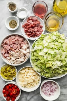 the ingredients for this salad are laid out in bowls