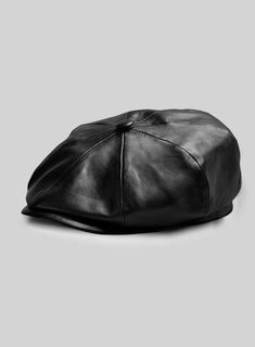 Our Newsboy Leather Cap is the perfect blend of old and new, with its vintage '20s look and modern leather construction.    Featuring an eight-panel construction and iconic top button for a classic look, plus a sleek inner viscose lining for comfort and style, this cap will make an impression in any era!  
 
 Made Using Pure Napa Sheep Skin Soft Leather.  
 
 Add a touch of flair to a casual ensemble with this stylish cap. Classic Leather Hat With Flat Bill, Classic Leather Flat Bill Hat, Retro Leather Cap, Classic Adjustable Six-panel Beret, Vintage Leather Hat With Flat Bill, Vintage Leather Flat Bill Hat, Classic Fitted Beret With Short Brim, Stylish Caps, Sheep Skin