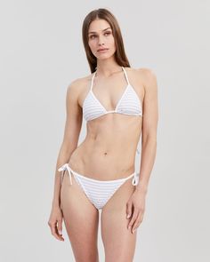 The Iris Ribbed Bikini Top - Solid & Striped Striped Triangle Top Swimwear For Beach, Striped Tie-side Swimwear For Swimming, Striped Seamless Fitted Swimwear, Striped Fitted Seamless Swimwear, Striped Tie-side Bottom Swimwear For Sunbathing, Fitted Striped Seamless Swimwear, Seamless Elastane Swimwear With Tie-side Bottom, Striped Tie-side Swimwear, Gesture Poses