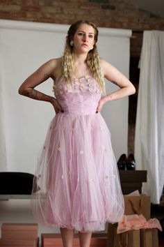 "Vintage 1950's pink tulle and taffeta strapless dress. No Label. The dress in a good vintage condition.  The dress has an opening on the left side, please see photo.   Size S. Please check measurements Bust 80 cm - 31,49\" Waist 70 cm - 27,55\" Length from under arm down 99 cm - 38,97\" Follow us on Instagram @by_waltz https://www.instagram.com/by_waltz/" Pink Strapless Ball Gown For Evening, Vintage Tulle Dress For Spring, Vintage Tulle Dresses For Spring, Pink Strapless Dress With Fitted Bodice For Wedding, Pink Strapless Dress For Debutante Ball And Prom Season, Pink Strapless Dress For Wedding Or Prom Season, Pink Strapless Dress For Debutante Ball During Prom Season, Vintage Fitted Tulle Dress, Vintage Pink Ball Gown Dress