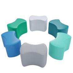 several different colored chairs arranged in a circle