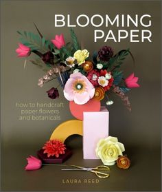 a book cover with flowers and scissors on it