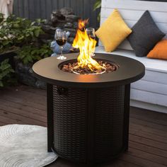 a fire pit sitting on top of a wooden deck