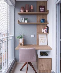 a home office with wooden shelves and pink chair in front of the desk on the balcony