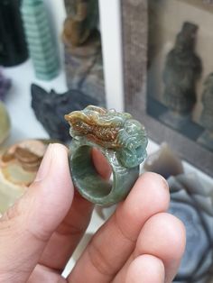 Vintage, collector's piece, auspicious Chinese Dragon carved Jade ring. Glossy, semitranslucent, grayish green with patches of red, Type A natural Jadeite (non-bleached, non-dyed, non-treated material). Ring size US 9.5 (61), weighs 17.64 grams, width 1.2 cm, height of Dragon from shank 1 cm. Green Intaglio Ring Jewelry, Unique Jade Gemstone Ring, Unique Carved Round Rings, Artisan Carved Rings, Carved Green Jade Rings, Green Carved Jade Rings, Carved Jade Rings As A Gift, Carved Jade Rings For A Gift, Carved Jade Ring Jewelry