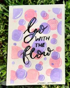 a card with the words go with the flow written on it