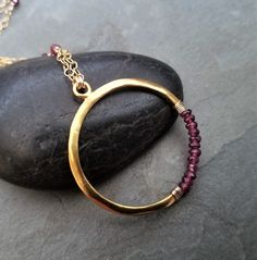 This item is made to order please allow 5 to 8 business days for your order to ship. This circle necklace was This necklace measures 16 inches in length and has a 2 inch extension chain for easy adjusting. The gold filled chain is intertwined with faceted rhodolite rondelle beads, the circle is completely handmade from 0.925 sterling silver followed by a heavy 14k gold plating and finished with genuine rhodolite rondelle beads. Crescent Necklace, Rhodolite Garnet, Blue Pearl, Circle Necklace, Stunning Necklace, Moon Necklace, Circle Pendant, Gorgeous Necklaces, Gold Filled Chain