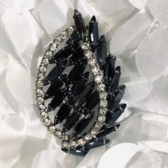 Vintage Black Glass And Rhinestone Silver Tone Brooch is absolutely a stunning Brooch there are no missing rhinestones none of the black glass is cracked or broken it measures 2 1/2 inches width and 1 1/2 inches length can be worn either way Black Brooch Jewelry For Wedding, Black Rhinestones Brooch For Gift, Black Brooch Jewelry For Party, Black Party Jewelry Brooch, Black Crystal Embellished Jewelry For Wedding, Black Crystal Embellished Wedding Jewelry, Glamorous Crystal Brooches For Evening, Glamorous Evening Crystal Brooches, Onyx Cufflinks