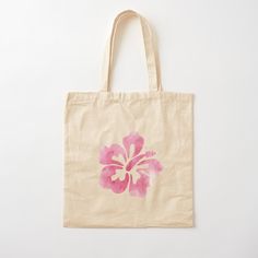 a tote bag with a pink flower painted on it