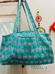 "Cotton Quilted block print weekend bags 100% cotton fabric SIZE: medium : 16\" x 8\" x 8 \" large : 18\" x 9\" x 9 Big Size :20\" x 10\" x 10\" the bags feature two pockets each on the outside :Color : Assorted & We Have More Color : Quilted Padding great for weekend getaways, beach trips and as carry on bags while travelling Ask me for custom orders, personalized pouches or wholesale CARE: Machine wash separately in cold water" Casual Cotton Rectangular Weekender Bag, Cotton Shoulder Beach Bag For Travel, Rectangular Cotton Travel Bag For Everyday Use, Multicolor Cotton Beach Bag For Travel, Rectangular Cotton Duffle Bag For Travel, Rectangular Cotton Weekender Bag For Travel, Green Cotton Travel Bag, Cotton Rectangular Duffle Bag For Everyday Use, Rectangular Cotton Duffle Bag For Everyday Use