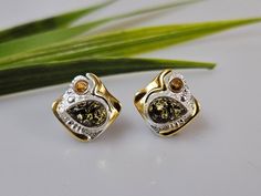 Baltic Amber + sterling silver 925. Multi colour Amber. with some gold plated parts  ,Silver 925 with hallmarks. Certificated product. Stunning stud in earrings about 1,3 cm length. Big square shape multi colour studs.  https://www.etsy.com/shop/AmberLithuania?ref=simple-shop-header-name&listing_id=780205095&section_id=27948198 This item was made of natural Baltic Amber. All the amber used in my jewelry is collected in my home country Lithuania.  I sell only genuine,  real, not pressed, authenti Fine Jewelry Yellow Earrings For Gift, Yellow Fine Jewelry Earrings For Gift, Yellow Hallmarked Earrings As A Gift, Handmade Amber Earrings For Anniversary, Unique Hallmarked Earrings For Anniversary, Earrings Big, Amber Earrings, Earrings Stud, Baltic Amber