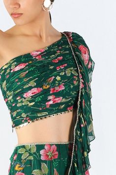 Green georgette ruffle pre-draped saree with floral print and gold acrylic scallops hand embroidered borders. Comes with a ruched oe-shoulder blouse.
Components: 2
Pattern: Printed, Hand embroidered
Type Of Work: Floral, Scallops
Neckline: One Shoulder
Sleeve Type: Sleeveless
Fabric: Georgette
Color: Green
Other Details: 
Closure: Blouse - Side zip
Occasion: Sangeet - Aza Fashions Fitted Pre-draped Saree With Floral Print For Festive Occasions, Fitted Floral Print Saree For Party, Party Blouse With Floral Print And Traditional Drape, Elegant Summer Pre-draped Saree With Dupatta, Elegant Party Blouse With Floral Print, Elegant Floral Print Blouse For Party, Elegant Pre-draped Saree For Summer Festivals, Elegant Pre-draped Summer Saree For Festive Occasions, Elegant Blouse Piece For Summer Reception