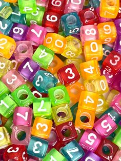 many different colored beads with numbers on them